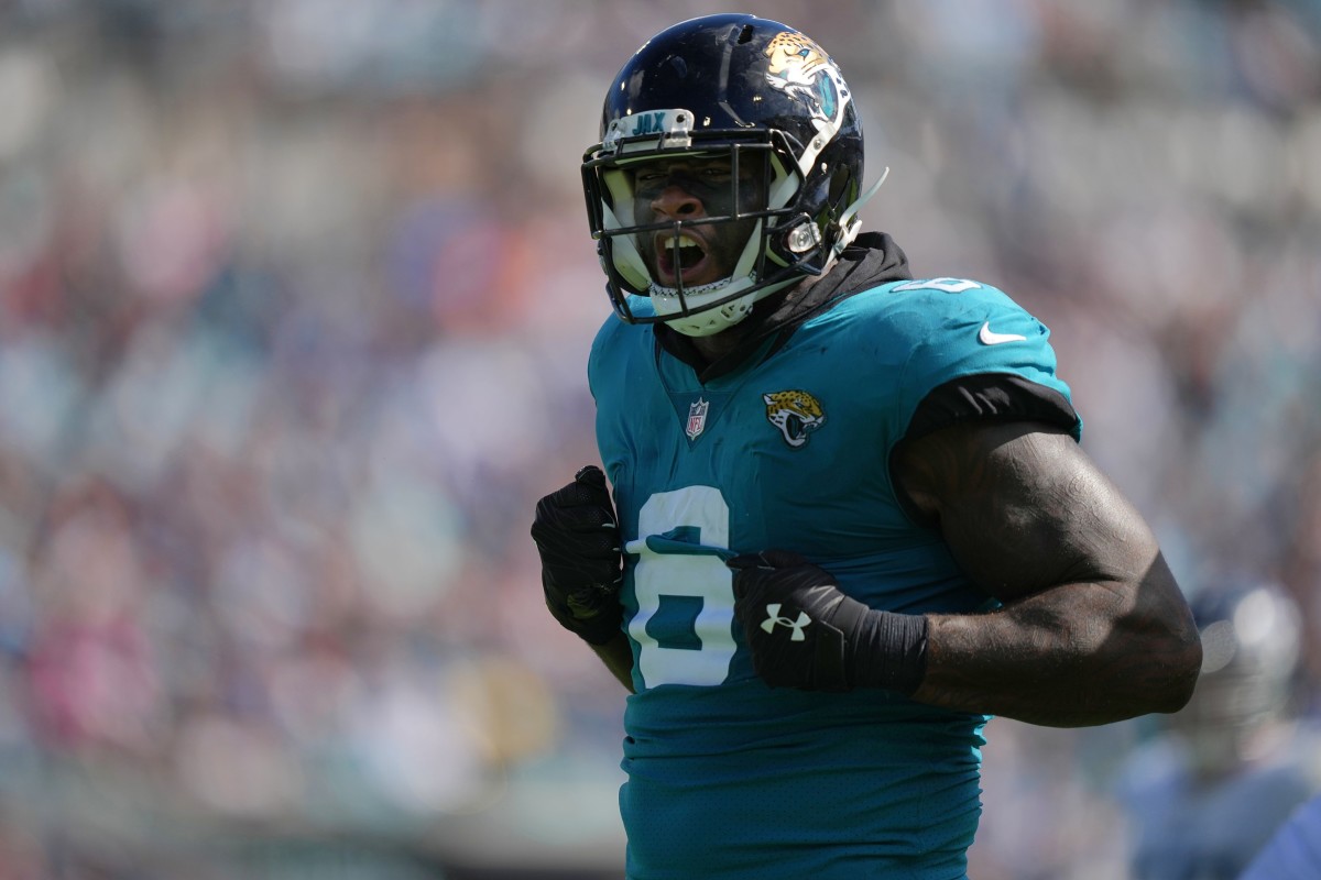 Oct 10, 2021; Jacksonville, Florida, USA; Jacksonville Jaguars defensive end Jihad Ward (6) reacts after tackling Tennessee Titans running back Jeremy McNichols (28) during the second half at TIAA Bank Field.